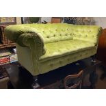 A VICTORIAN DROP END CHESTERFIELD SETTEE Button back green fabric upholstery. (163cm x 92cm x 76cm)