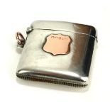 A VICTORIAN SILVER AND 9CT GOLD RECTANGULAR VESTA CASE With applied 9ct gold cartouche, hallmarked
