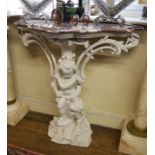 A 19TH CENTURY CONSOLE TABLE With serpentine form rouge marble top supported by two putti in cream