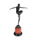 AN ART DECO STYLE BRONZE STATUE OF A SEMICLAD FEMALE DANCER On circular rouge and black marble base.