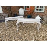 A PAIR OF CONTINENTAL CONSOLE TABLE With rectangular ogee tops, above a carved apron raised on