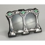 A SMALL SILVER AND ENAMEL ART NOUVEAU DESIGN DOUBLE PHOTO FRAME Stylized organic form with easel