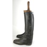 A PAIR OF 19TH CENTURY LEATHER RIDING BOOTS AND WOODEN TREES Hand stitched seam to rear, together