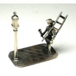 A DUTCH SILVER NOVELTY 'GAS LAMP LIGHTER' FIGURE Gent wearing period clothing with ladder and