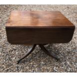 A REGENCY MAHOGANY PEMBROKE TABLE With real and false drawers, Rasal turn column with four splayed