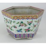 A CHINESE FAMILLE ROSE HEXAGONAL PORCELAIN JARDINIÈRE With Greek Key border and floral