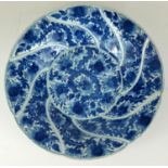 A 19TH CENTURY CHINESE BLUE AND WHITE PORCELAIN CHARGER DISH Having a spiral design with Buddhist