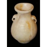 A CHINESE WHITE JADE BALUSTER VASE With mask handles and carved bamboo design and having a