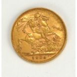 A KING EDWARD VII 22CT GOLD FULL SOVEREIGN COIN, DATED 1904 With George and Dragon to reverse.
