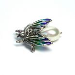 A SILVER MARCASITE PLIQUE-À-JOUR DESIGN INSECT BROOCH Having paste set wings and mother of pearl