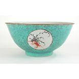 A CHINESE TURQUOISE GLAZE PORCELAIN BOWL Having circular cartouche panels hand painted with exotic