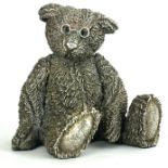 A LARGE 20TH CENTURY FILLED SILVER TEDDY BEAR Seated pose with spectacles. (approx 10cm x 12cm)