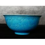 A CHINESE BLUE GLAZE PORCELAIN BOWL Hand painted underglaze decoration of phoenix birds, bearing a