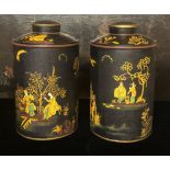 A PAIR OF LARGE TOLEWARE TEA CANISTERS AND COVERS With Japanned decoration on a black ground. (40cm)