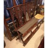 A 19TH CENTURY CHINESE HARDWOOD FOLDING DOUBLE CHAIR BENCH With pierced and carved back panels,