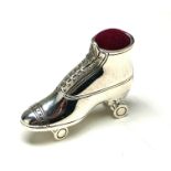 A STERLING SILVER NOVELTY 'ROLLER SKATE' PIN CUSHION The single skate with red velvet cushion. (