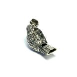 A SILVER NOVELTY BIRD FORM WHISTLE Having engraved decoration and pendant loop. (approx 3.5cm)