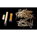 A COLLECTION OF TWENTY VICTORIAN CARVED BONE LACE SEWING BOBBINS Each having glass bead finials,