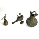 A PERSIAN BRONZE CARAFE Having a snake form swing handle with chased decoration of exotic birds