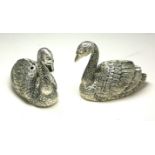 A PAIR OF CONTINENTAL SILVER 'SWAN' SALT AND PEPPER POTS Having glass set eyes. (approx 4cm x 5cm)