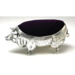 A LARGE CONTINENTAL SILVER NOVELTY 'PIG' PIN CUSHION Standing pose with purple velvet cushion. (