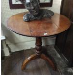 A 19TH CENTURY OAK SUPPER CIRCULAR TOP TABLE Raised on a turned column and three splayed legs. (