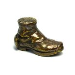 A BRASS NOVELTY 'OLD BOOT' VESTA CASE Having a hinged compartment and strike to top. (approx 5cm)