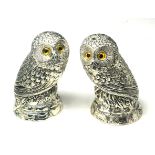 A PAIR OF CONTINENTAL SILVER 'OWL' SALT AND PEPOER POTS Standing pose with glass set eyes (approx