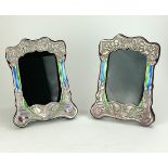 A PAIR OF SILVER AND ENAMEL ART NOUVEAU DESIGN BUTTERFLY PHOTO FRAMES Having organic form frame with