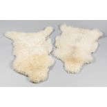 TWO 20TH CENTURY SHEEP SKIN RUGS (l 105cm)