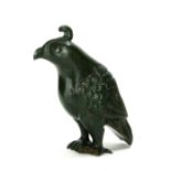 A CHINESE CARVED HARDSTONE BIRD SCULPTURE Standing pose with carved plumage. (approx 18cm)