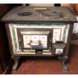 A LATE 19TH CENTURY DUTCH IRON AND TILED STOVE. (82cm x 49cm x 72cm)