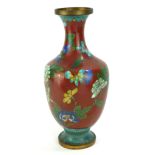 A PAIR OF CHINESE CLOISONNÉ BALUSTER VASES Decorated with flowers on red grounds. (24cm)