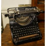 A VINTAGE OLYMPIA TYPEWRITER.