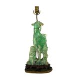 A CHINESE GREEN QUARTZ TABLE LAMP Carved as a Phoenix on hardwood stand. (55cm) Condition: good