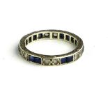 A VINTAGE 9CT WHITE GOLD, SAPPHIRE AND PASTE ETERNITY RING Having square cut stones interspersed