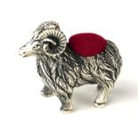A STERLING SILVER NOVELTY 'RAM' PIN CUSHION Standing pose, with red velvet cushion. (approx 3.5cm)