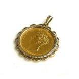 A GEORGE IV 1827 GOLD SOVEREIGN Kings head, shield back, in a 9ct gold mount.