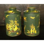 A LARGE PAIR OF TOLEWARE TEA CANISTERS AND COVERS With japanned decoration on a green ground. (40cm)