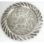 AN INDIAN SILVER SALVER Having a fine chased engraving of a continuous landscape with animals and