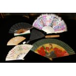 A COLLECTION OF LATE 19TH CENTURY FANS Comprising a Chinese carved bone fan with painted feathers, a