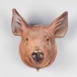A 20TH CENTURY IMITATION PIGS HEAD (h 30cm x w 30cm x d 23cm)
