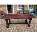 A 17TH CENTURY DESIGN FRUITWOOD REFECTORY TABLE With three plank tops, raised on cannon barrel