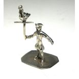 A DUTCH SILVER NOVELTY FIGURE Gent wearing period clothing with exotic bird. (approx 4cm)