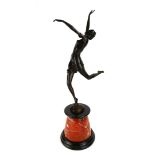 AN ART DECO STYLE BRONZE STATUE OF A SEMICLAD FEMALE DANCER Raised on a tapering rouge marble