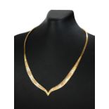 A 9CT TRICOLOUR GOLD NECKLACE Tapering 'V' form with white, yellow and rose finish, in original