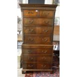A GEORGE III DESIGN MAHOGANY TALLBOY With two short above six graduated drawers, with brushing slide