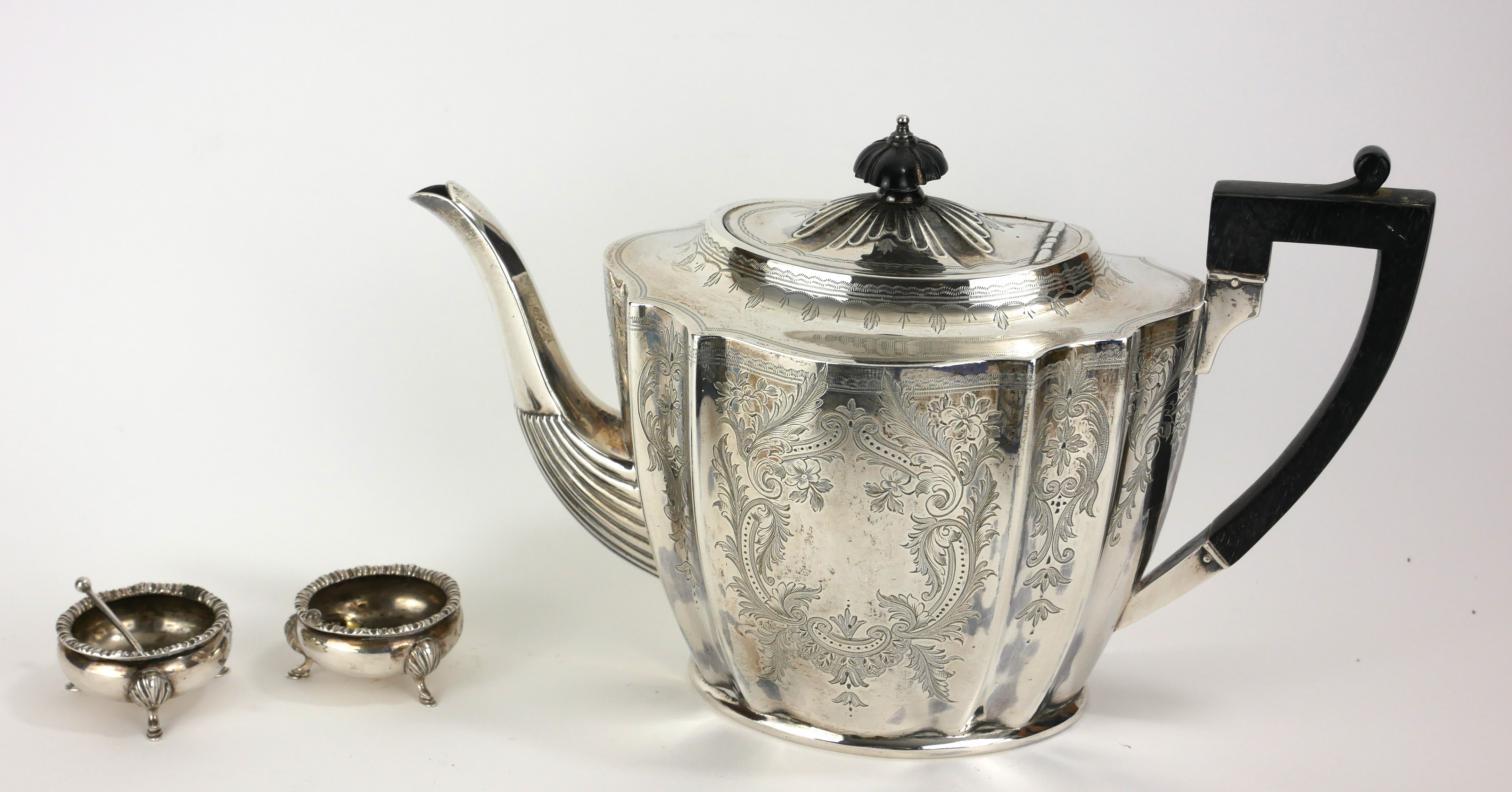 A VICTORIAN SILVER TEAPOT Having ebonised finial and handle, fluted body with engraved decoration,