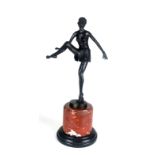 AN ART DECO STYLE BRONZE STATUE OF A SEMICLAD FEMALE DANCER Raised on a circular rouge and black