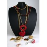 A COLLECTION OF FIVE LARGE GOLD PLATED AND PASTE SET COSTUME JEWELLERY HEART FORM PENDANT NECKLACE